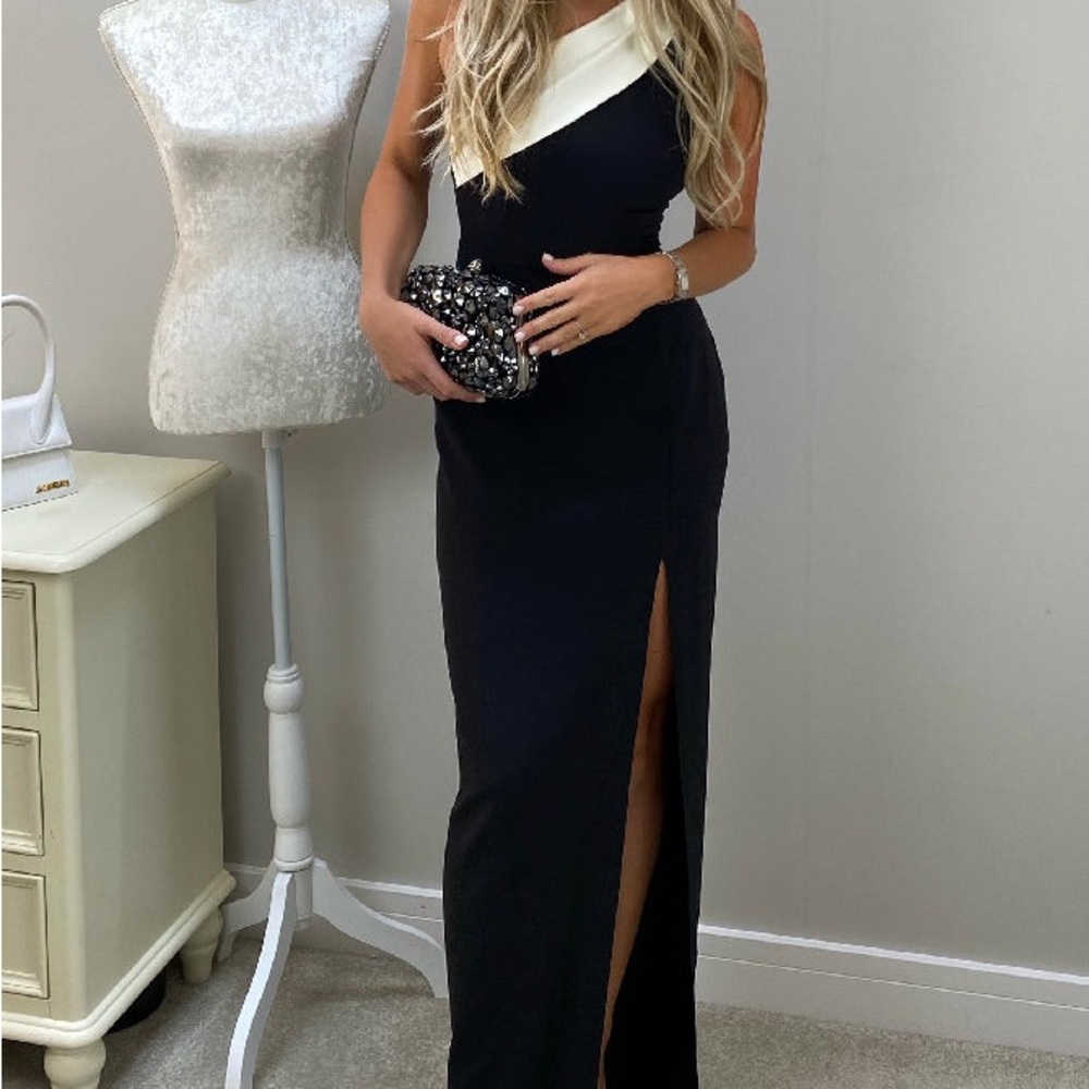 Beautiful long black dress with slit. White boarder on top